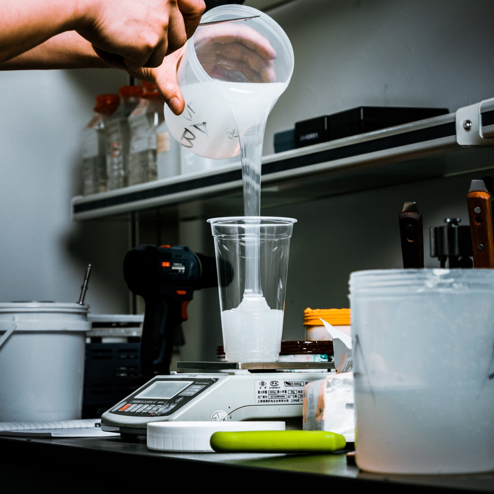 iGoods sexy toys factory worker preparing silicone material for dildo production