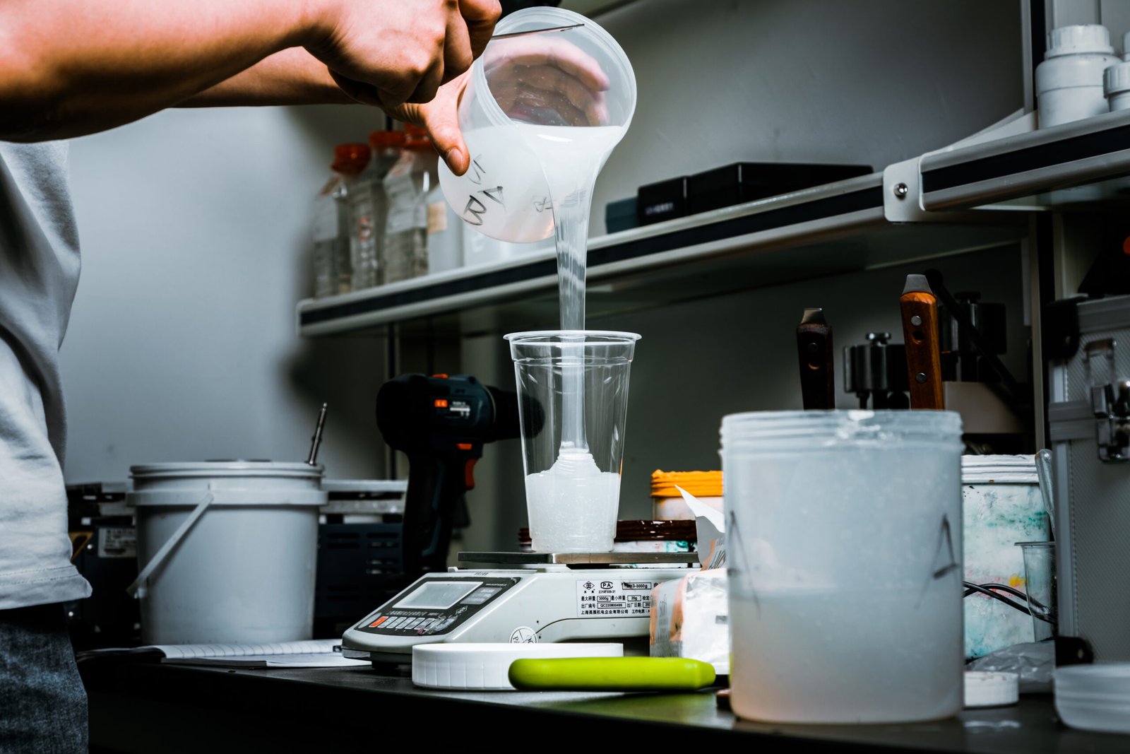 iGoods sexy toys factory worker preparing silicone material for dildo production