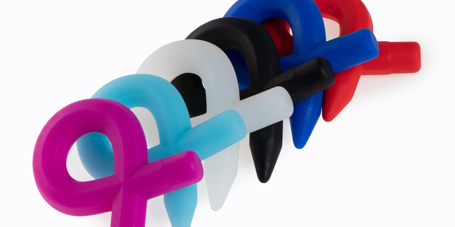 Colorful silicone cock rings with a pointed pencil-tip design, shown in pink, blue, white, black, and red