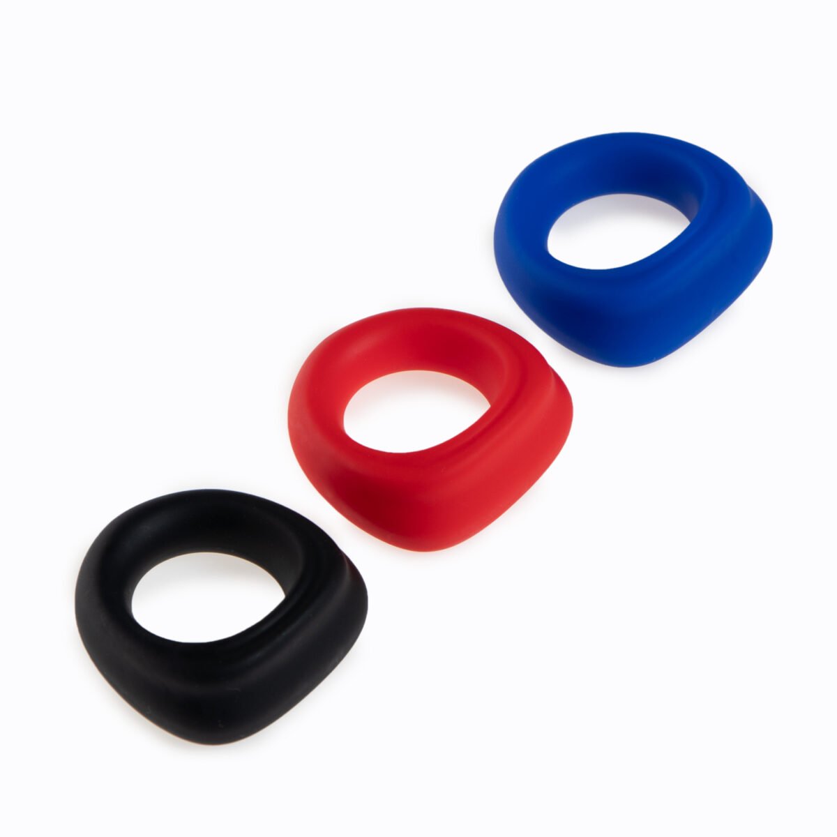 mens cock ring in black, red and blue colors on white background for bulk wholesale